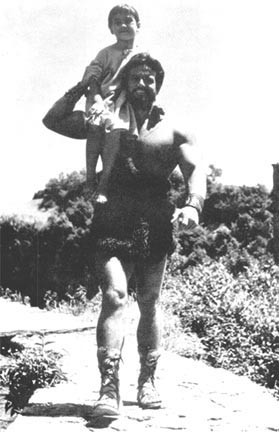 Steve Reeves giving a kid a lift.