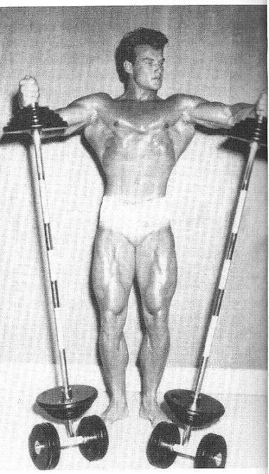 Steve Reeves holding up two barbells