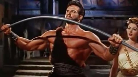 Steve Reeves with a show of strength in Hercules